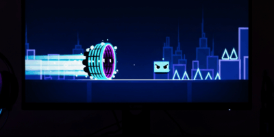 gaming monitor displaying neon geometry dash wave segment wi 20260428 070115